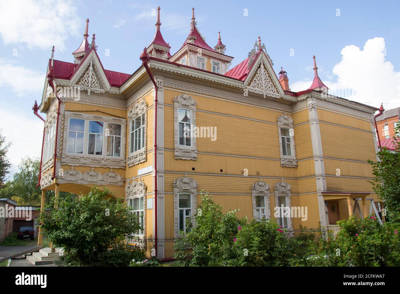 Russian style in architecture. House with firebirds, Wooden house, Tomsk, Russia. Beautiful carved elements of Russian Northern architecture Stock Photo