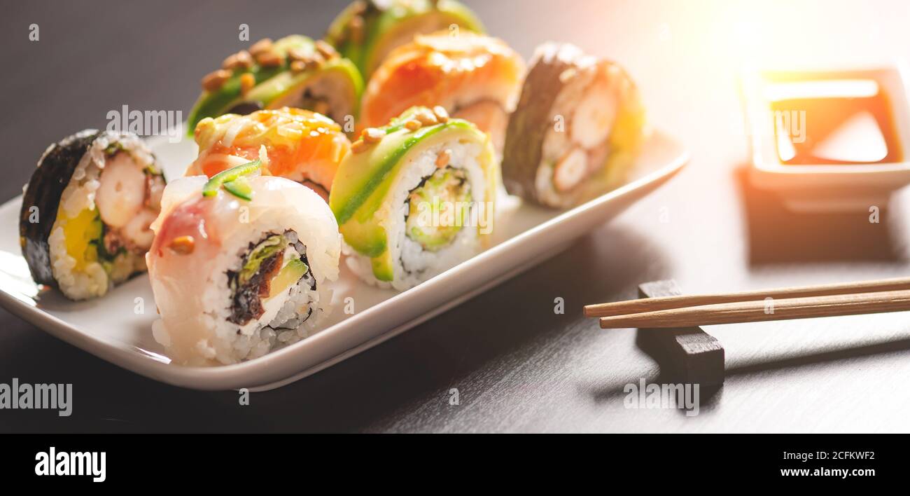 Sushi roll set on plate. Japanese Asian traditional food front view Stock Photo