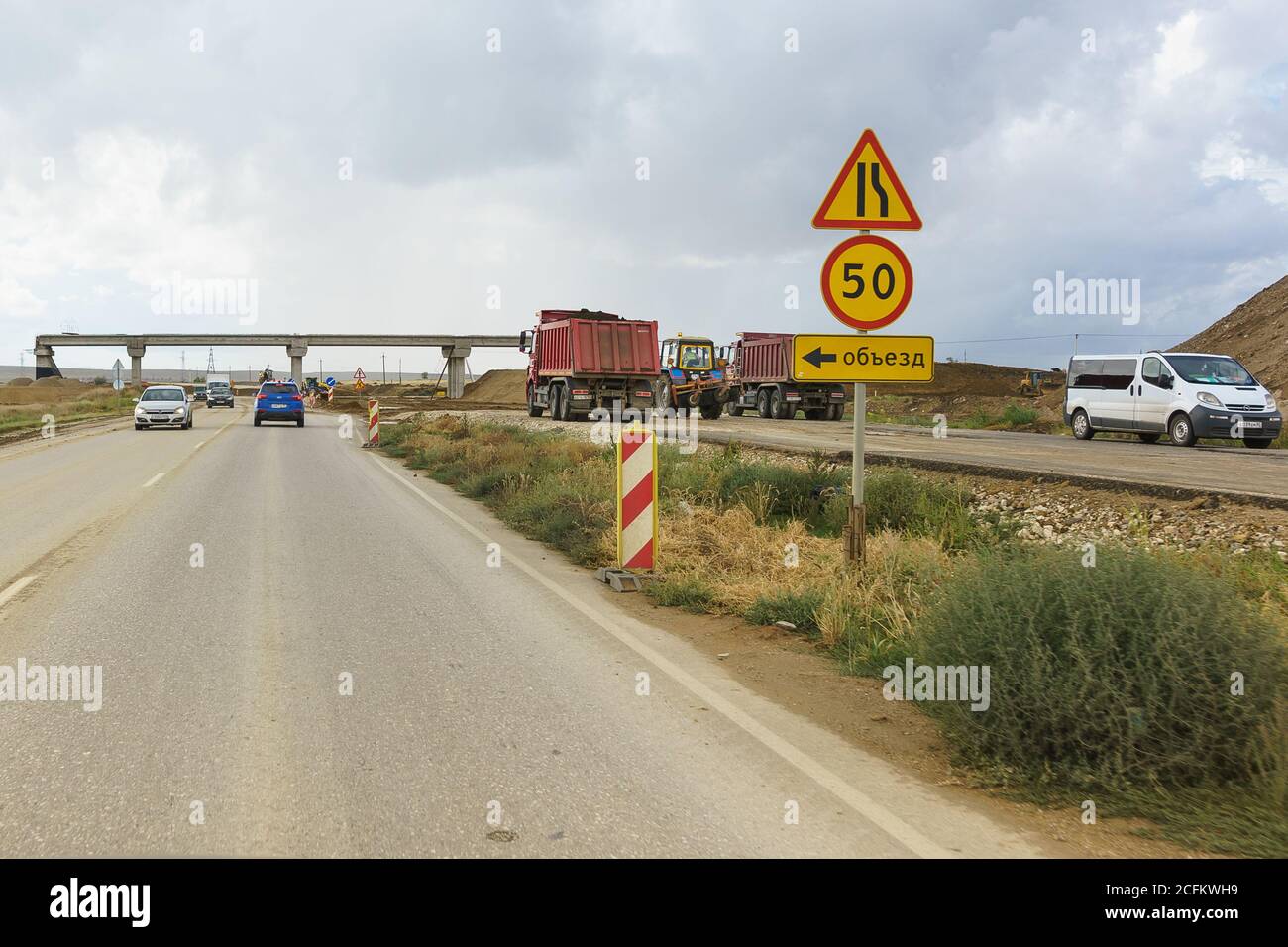 Tavrida highway, Crimea, Russia-September 07, 2018: road signs Detour, road narrowing and speed limits on the section of construction roads of the new Stock Photo