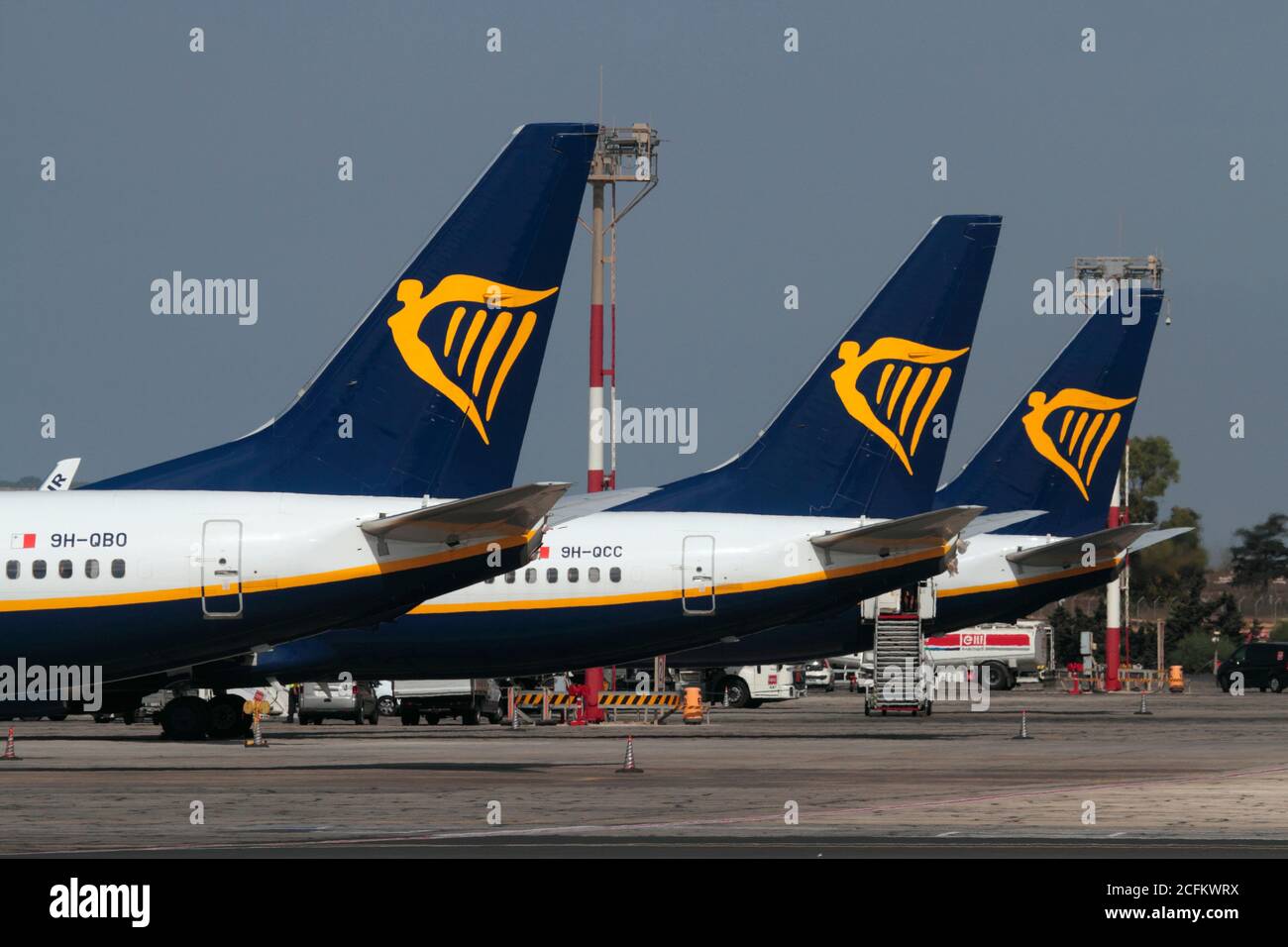 Ryanair Boeing 737-800 airliner tails bearing the logo of the low-cost airline on the ramp at Malta International Airport Stock Photo