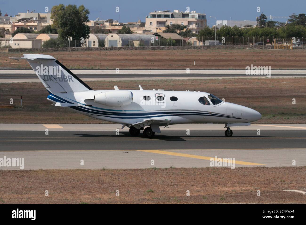 Cessna Citation Mustang small business jet taxiing on arrival in Malta. Side view. Stock Photo