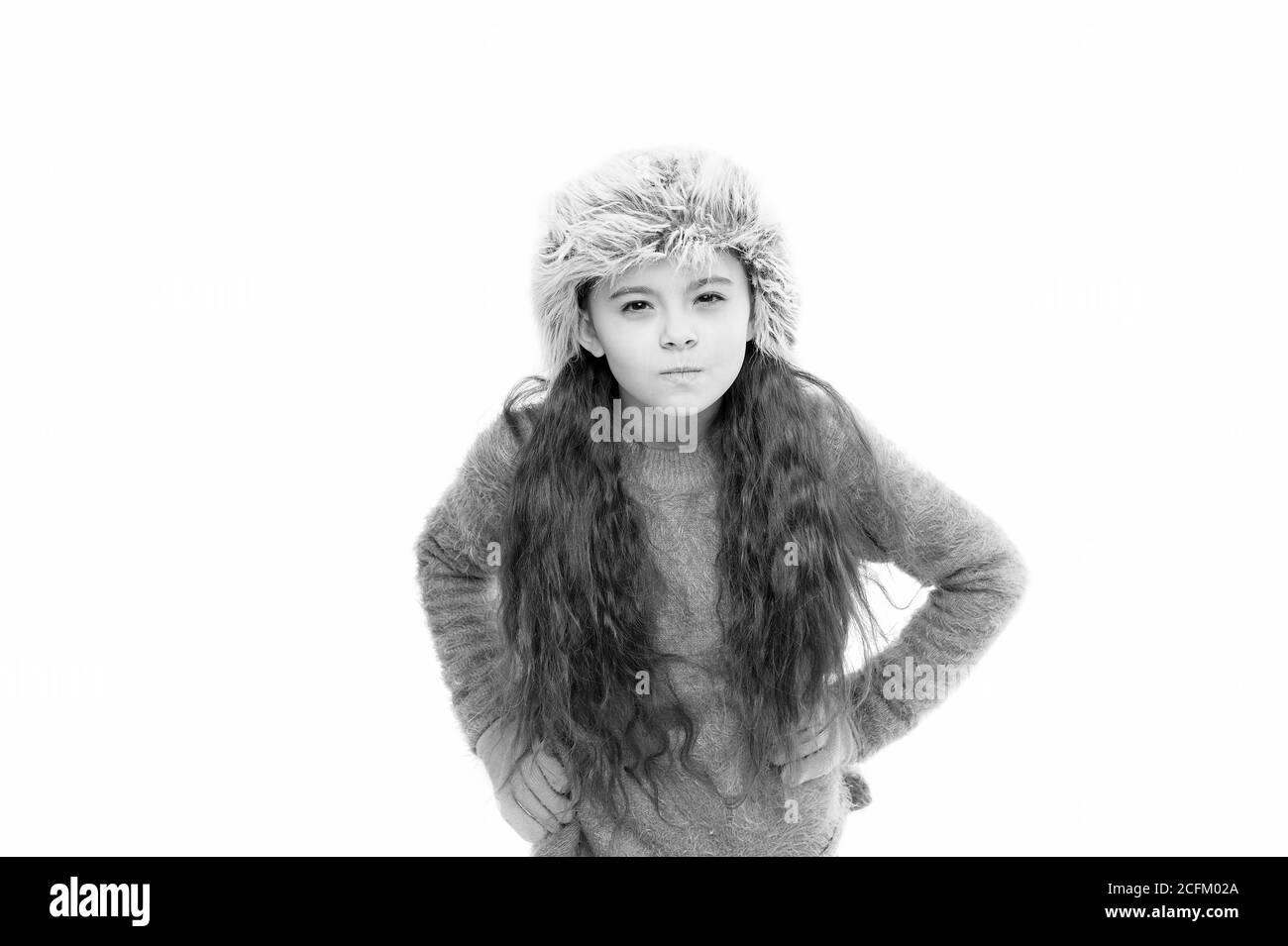 Static and frizz. Adorable child long hair soft fur hat. Child care concept. Girl long hair wear fur hat white background. Winter shampoo and conditioner prevent hair damage. Anti static hair product Static and frizz. Adorable child long hair soft fur hat. Child care concept. Girl long hair wear fur hat white background. Winter shampoo and conditioner prevent hair damage. Anti static hair product