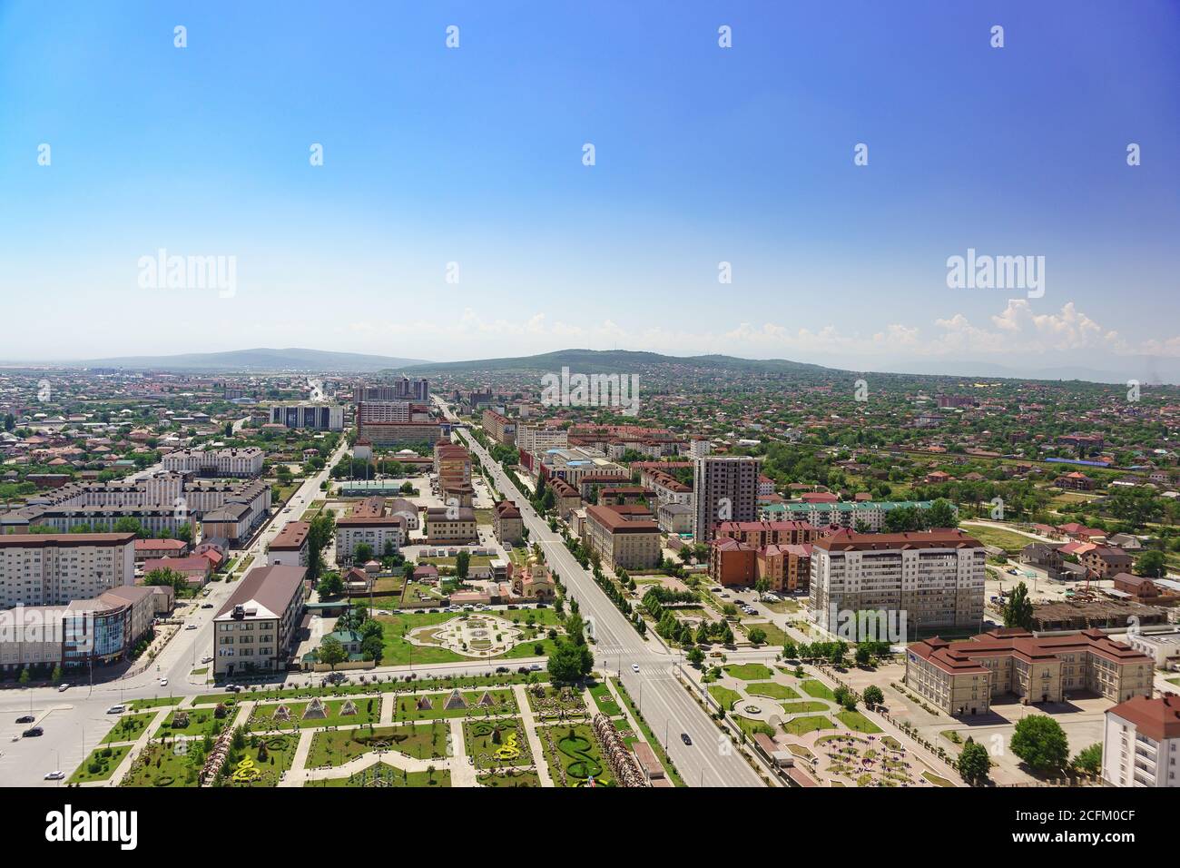 Grozny, Chechen Republic, Russia - June 02, 2019: View from the observation deck of the Grozny city high-rise complex towards the Flower Park and Akhm Stock Photo