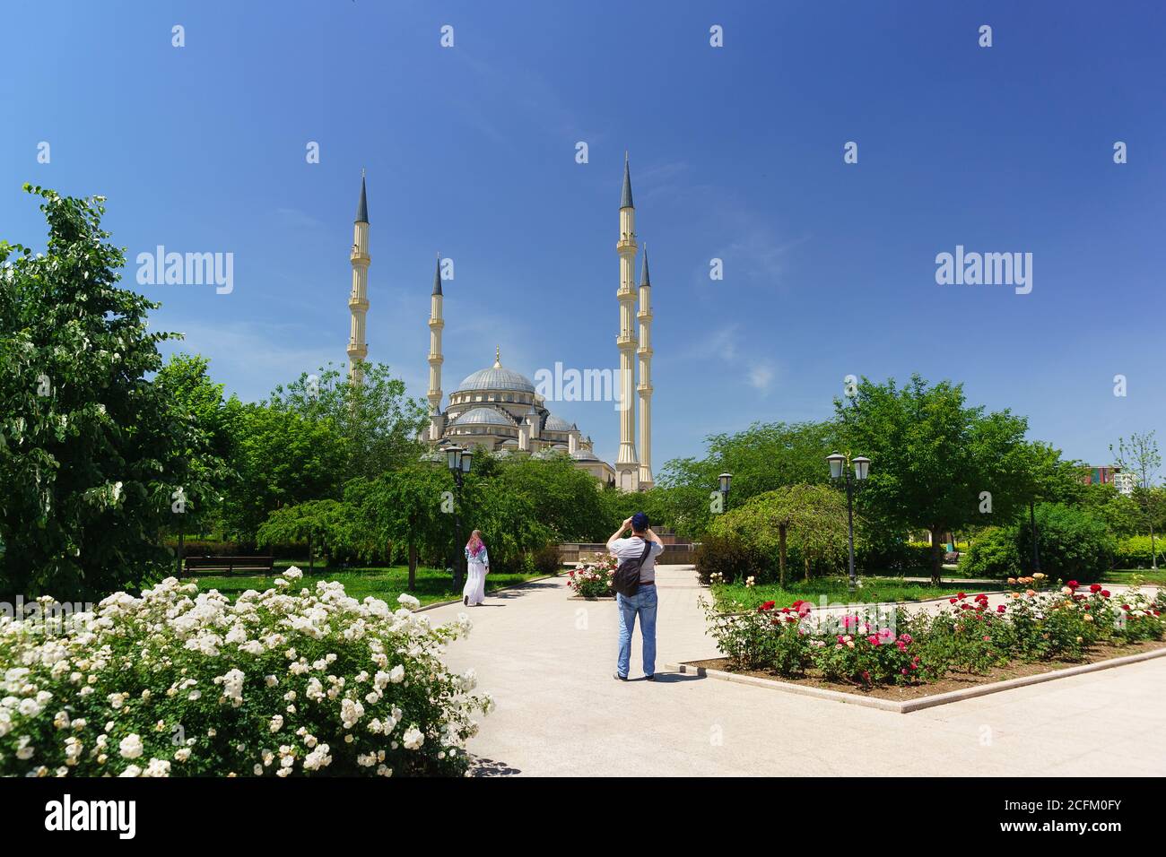 Grozny, Chechen Republic, Russia - June 02, 2019: Tourists walk in the Park near the mosque Heart of Chechnya. Sunny summer day Stock Photo