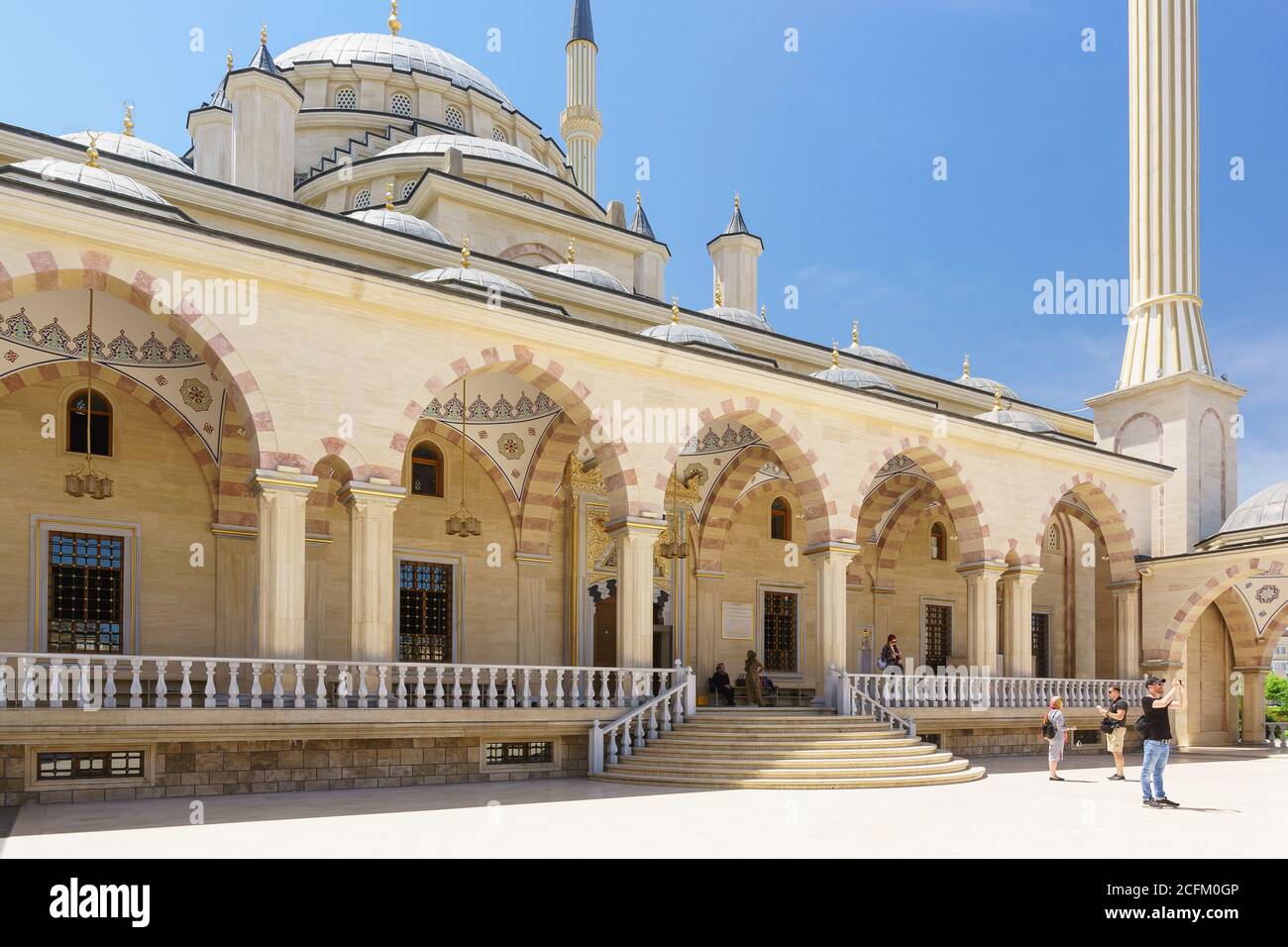 Grozny, Chechen Republic, Russia - June 02, 2019: Entrance to the Akhmat Kadyrov heart of Chechnya mosque in the capital of Ichkeria from the summer g Stock Photo