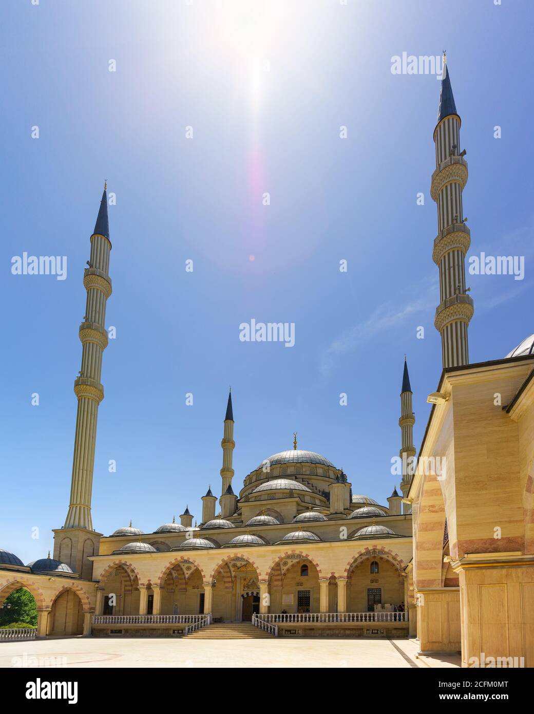 Grozny, Chechen Republic, Russia - June 02, 2019: Bright Sunny sky over the domes and minarets of the Akhmat Kadyrov heart of Chechnya mosque Stock Photo