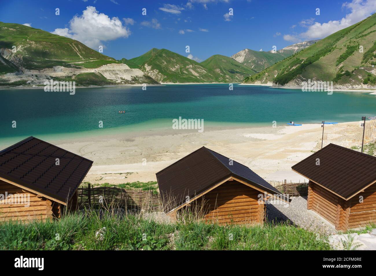 Vedensky district, Chechen Republic, Russia - June 01, 2019: Roofs of gazebos for rest on the shore of the high-mountain lake Kezenoi Am. Weekend in e Stock Photo