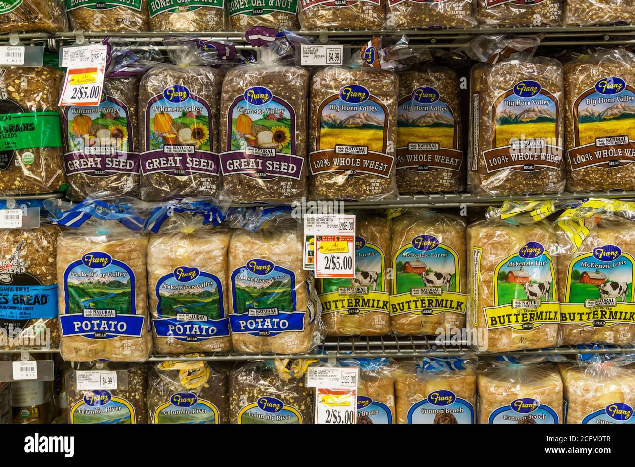 Different varieties of American bread for sale in a supermarket. Stock Photo