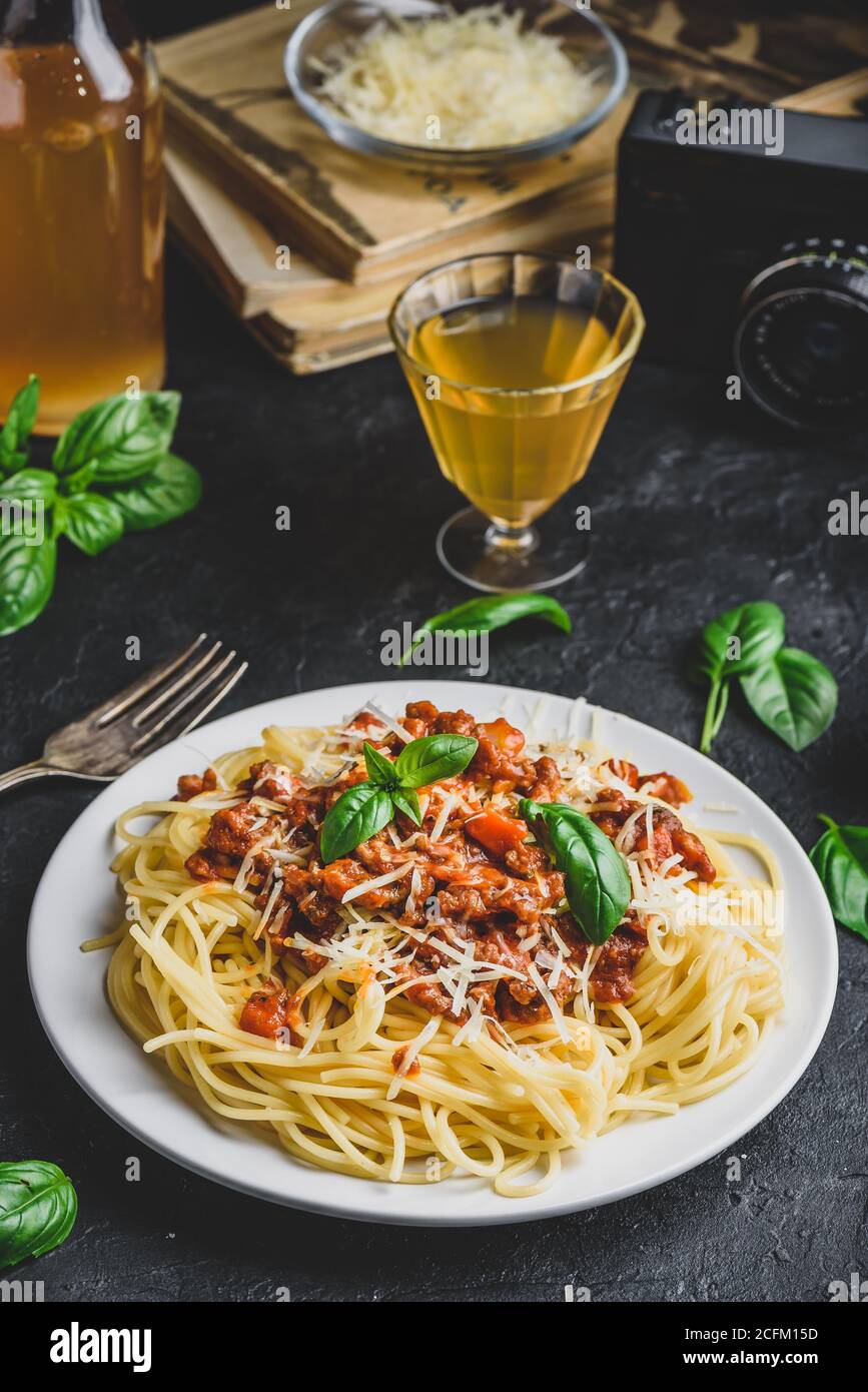 Spaghetti with bolognese sauce, parmesan and basil Stock Photo