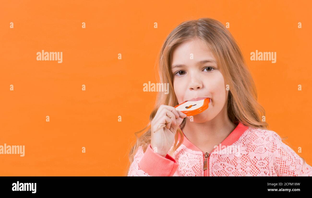 Child eat candy on stick, food. Little girl with lollipop, snack. Food