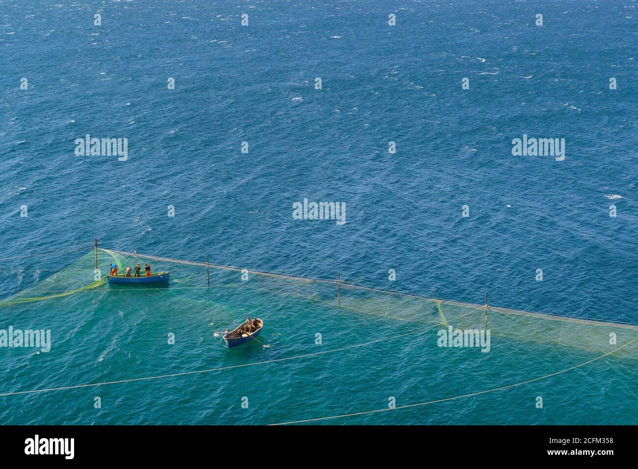 Tarkhankut, Crimea, Russia-September 11, 2019: people on boats check nets in the Black sea. Fisherman's camp in the Park Atlesh Stock Photo