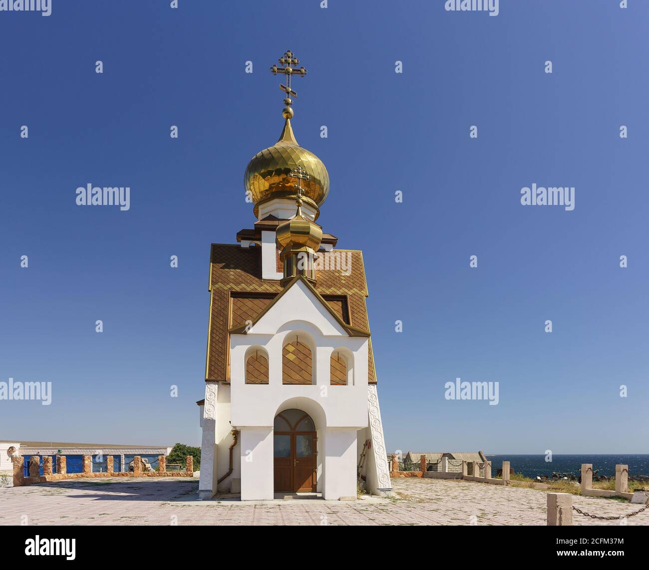 The temple is a chapel located on the edge of Cape Tarhankut. Named after the defender of sailors and fishermen - Nicholas the Wonderworker. Crimea Stock Photo