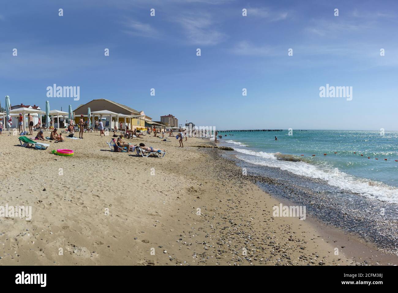 Yevpatoria, Crimea, Russia-12 September 2019: New beach on the outskirts of the resort town. The white sand and gently sloping beach attracts a lot of Stock Photo