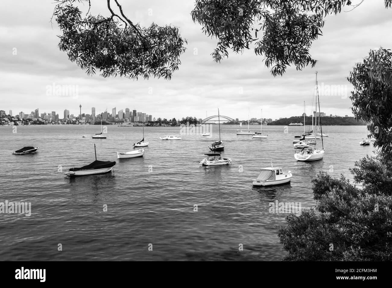 Sydney skyline and Harbour bridge from Hermit Bay Stock Photo