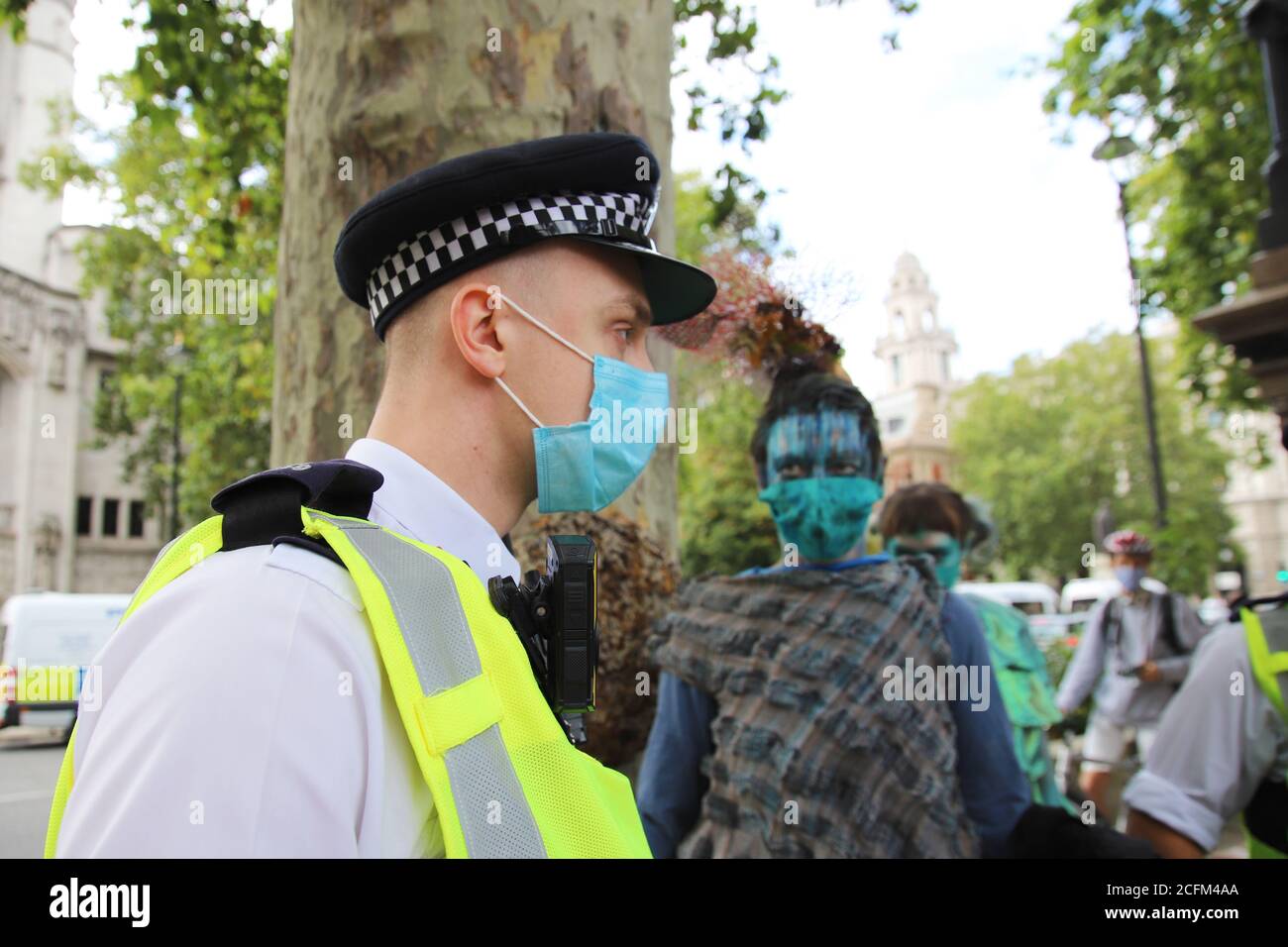 London, UK. 06th Sep, 2020. Extinction Rebellion protestors march from Parliament Square to Tate Modern to highlight the dangers to marine life from global warming and climate change, 6th September 2020. Protestors face police on parliament square Credit: Denise Laura Baker/Alamy Live News Stock Photo