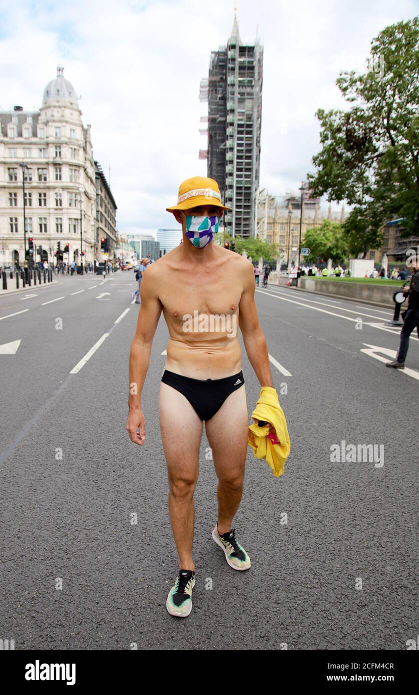 London, UK. 06th Sep, 2020. Extinction Rebellion protestors march from Parliament Square to Tate Modern to highlight the dangers to marine life from global warming and climate change, 6th September 2020. A protestor in swimming trunks leads the march Credit: Denise Laura Baker/Alamy Live News Stock Photo