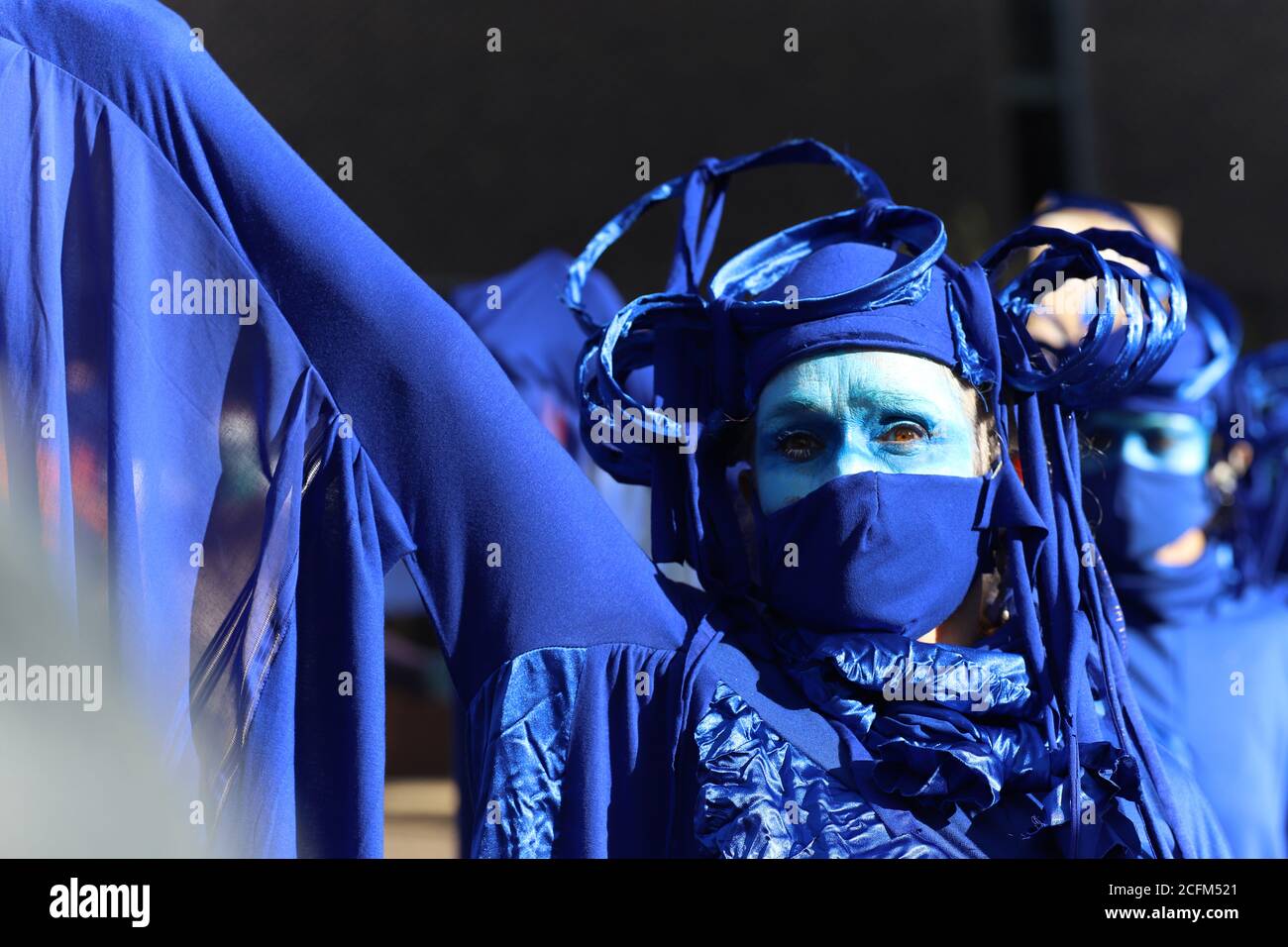 London, UK. 06th Sep, 2020. Extinction Rebellion protestors march from Parliament Square to Tate Modern to highlight the dangers to marine life from global warming and climate change, 6th September 2020. Protestors dressed in blue referred to as 'the wave' move in wave formation through the streets Credit: Denise Laura Baker/Alamy Live News Stock Photo