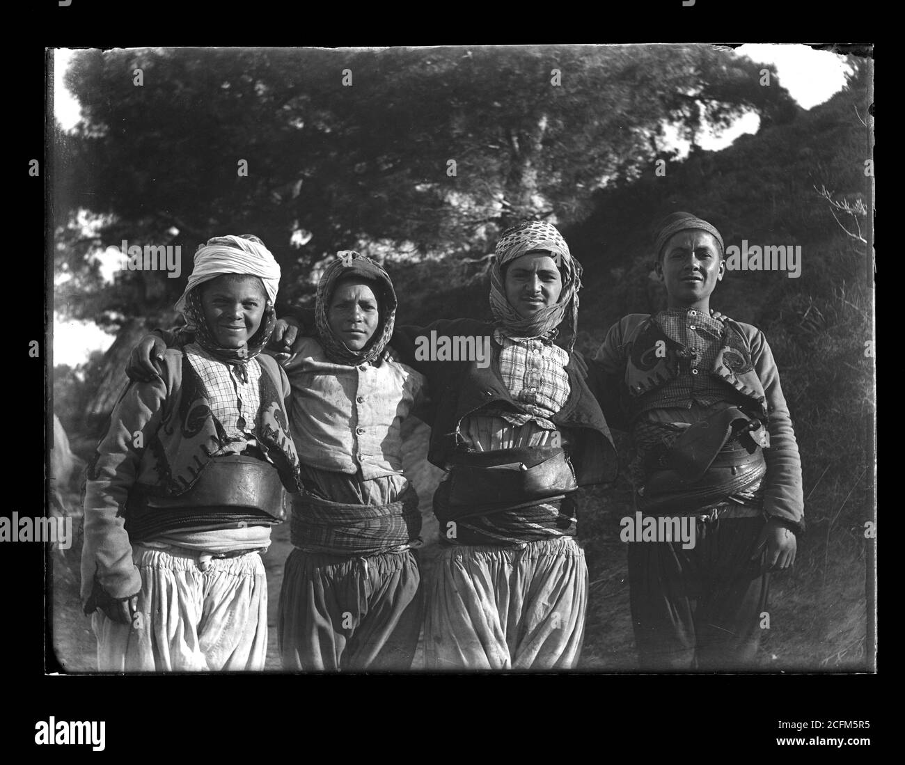 Group of young Albanian men in typical customes in or near Smyrna / Izmir Turkey. Photograph on dry glass plate from the Herry W. Schaefer collection, around 1910. Stock Photo