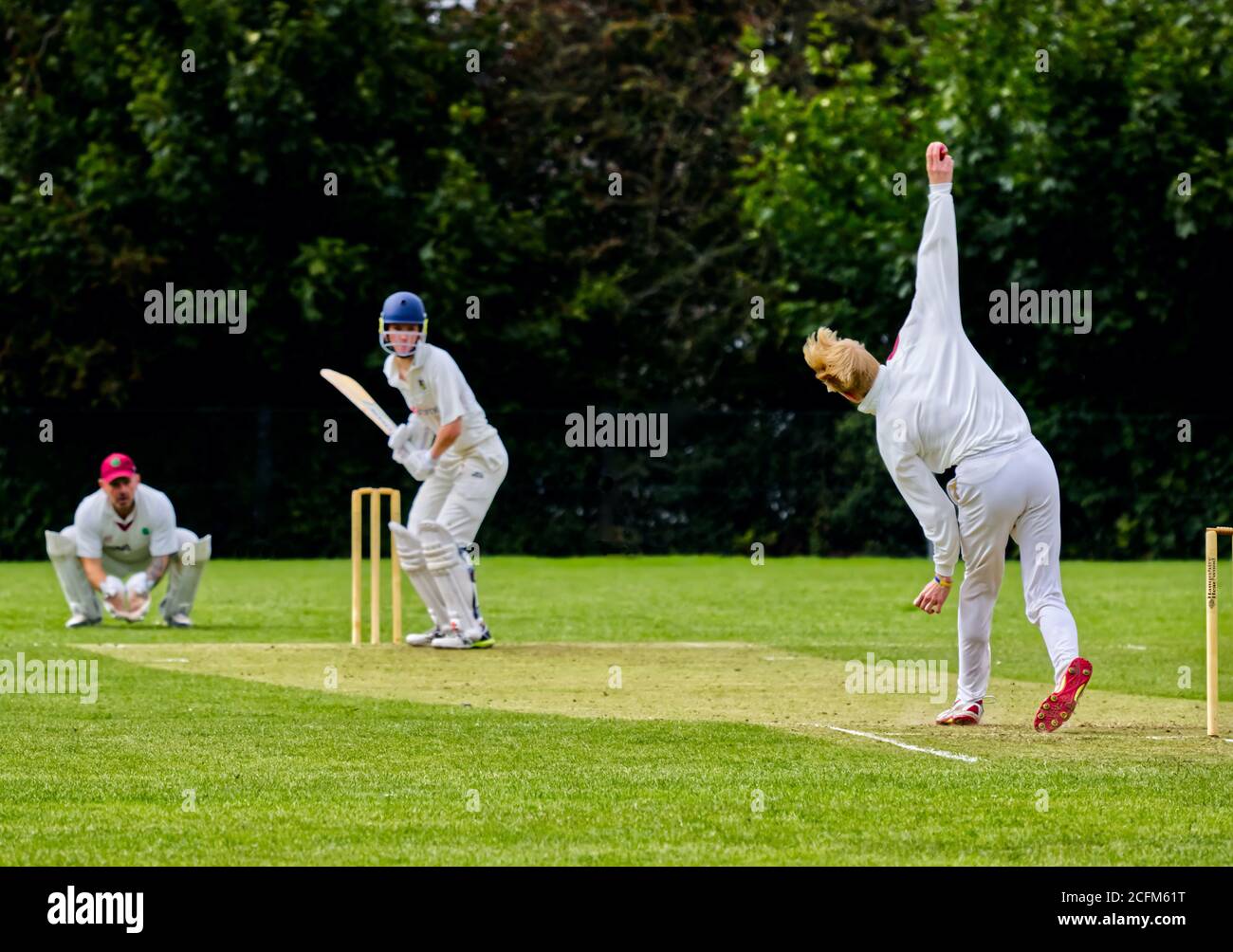 Bowling to a batsman in a village cricket match Stock Photo