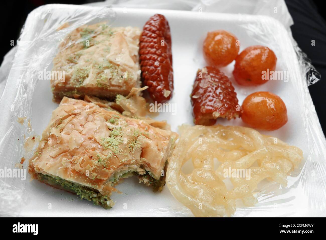 Middle Eastern Pastry: Zoolbia, Pistacio and Walnut Baklava, Kalbura Basti, Luqaimat Stock Photo