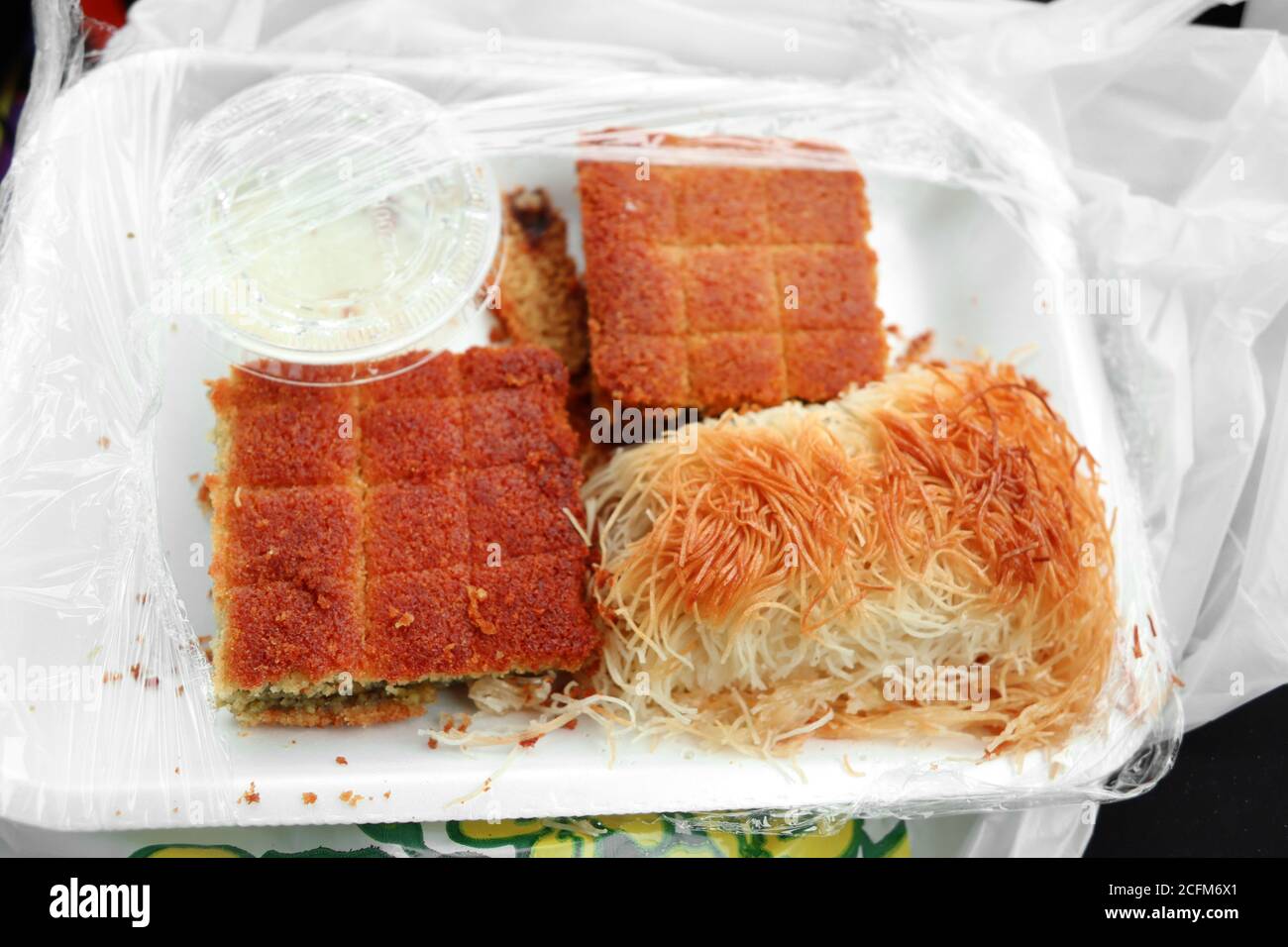 Middle Eastern Sesame and Pistachio Pastry in Detroit Muslim Community Store Stock Photo