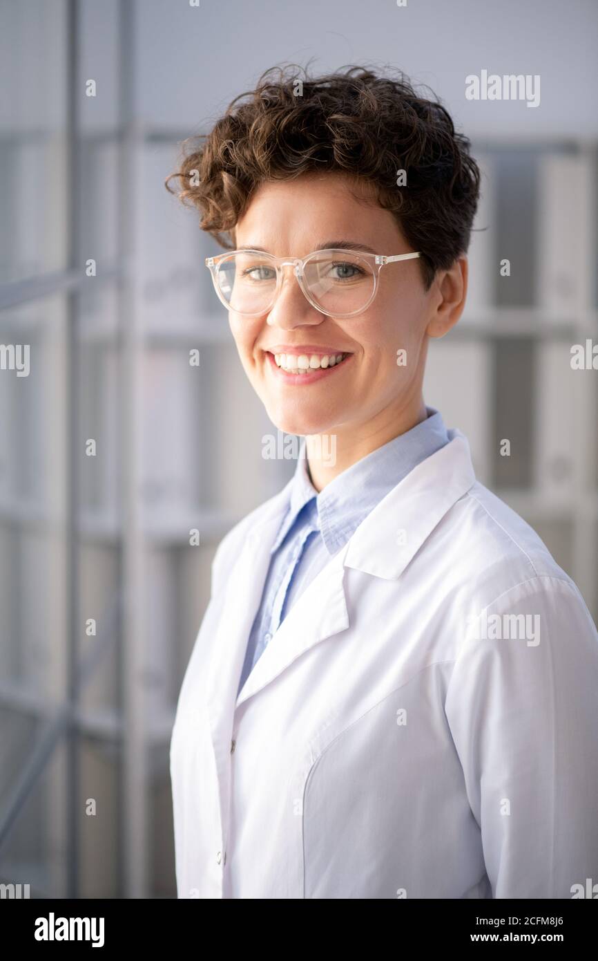 Young successful female scientist standing in front of camera in scientific lab Stock Photo