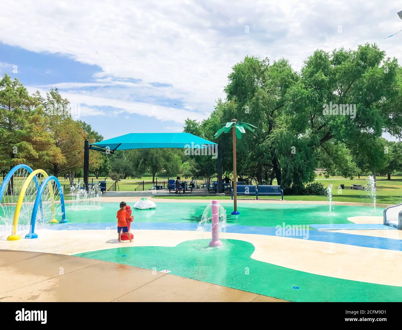 Modern splash park with shaded picnic areas for summertime activities