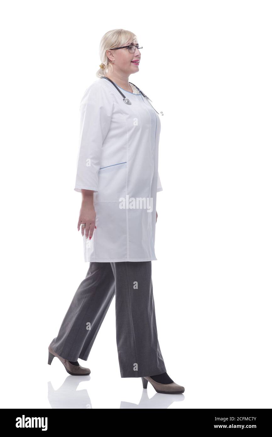 confident woman doctor goes to help. isolated on a white Stock Photo ...