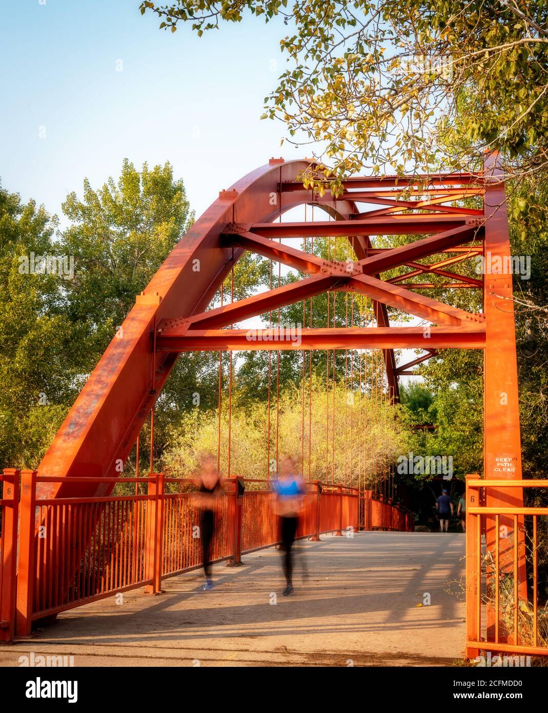 Red bridge crossing the Boise river with Joggers Stock Photo - Alamy