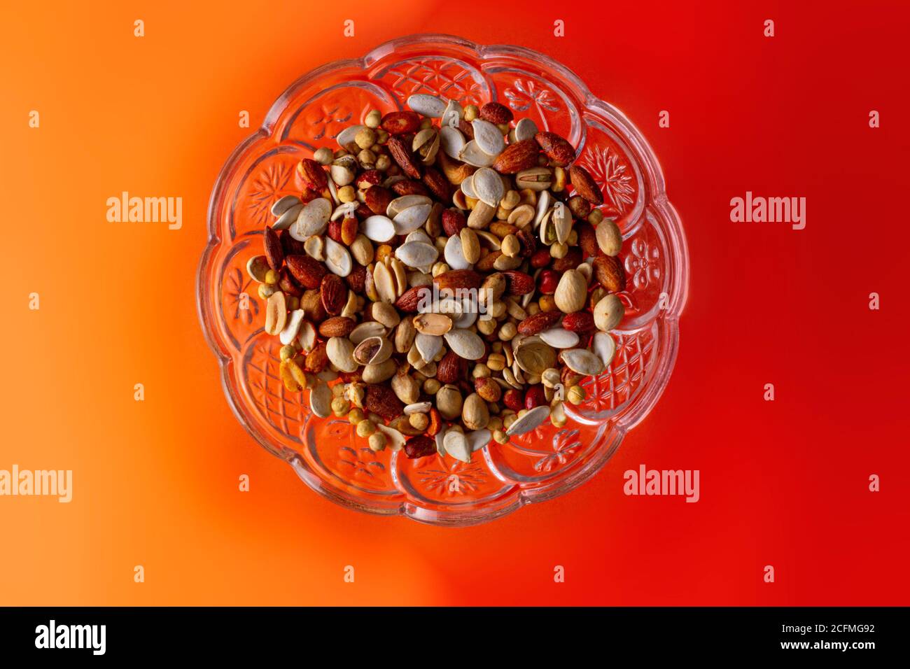 Top shot of a dry fruits on an orange table Stock Photo