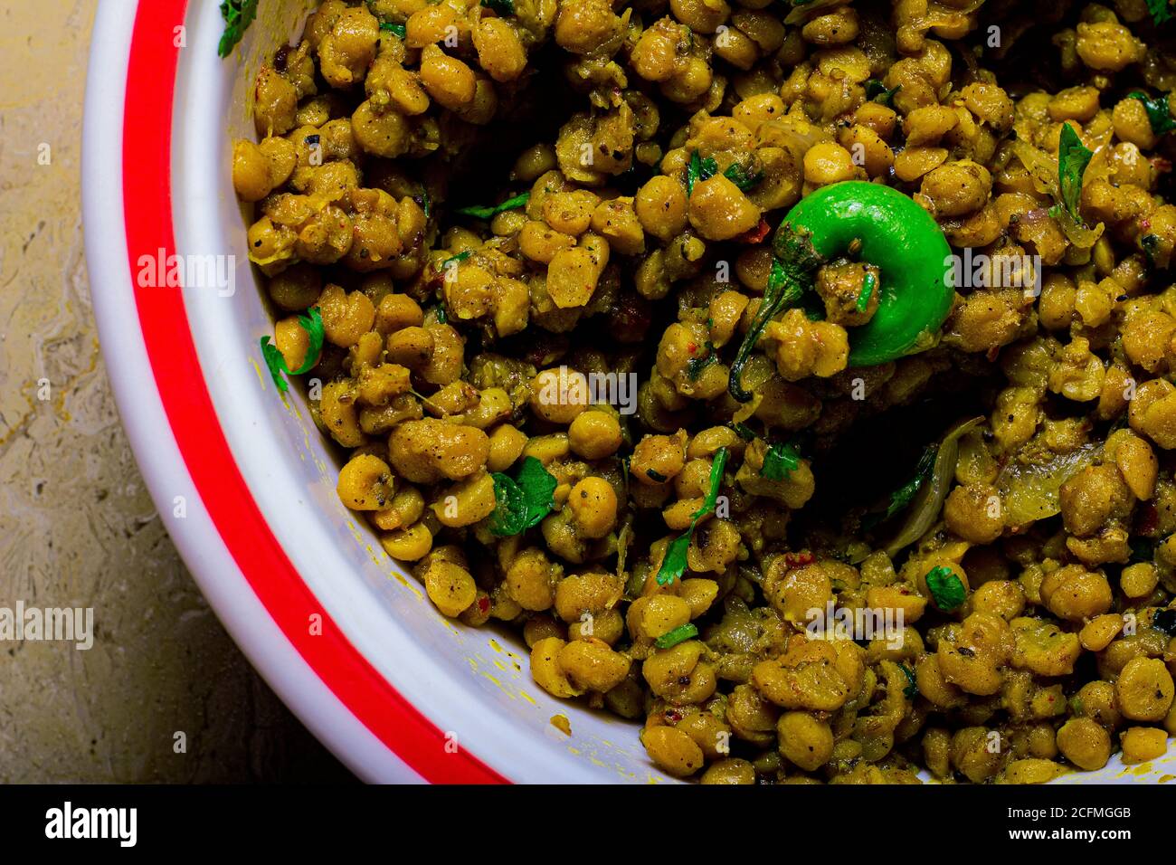 Spicy dry yellow peas in a pot Stock Photo