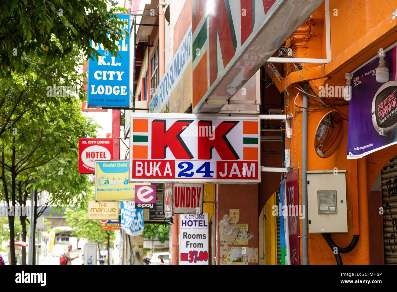 A Sign Of A Grocery Store On The Facade Of The Building Lots Of Ad Banners Stock Photo Alamy