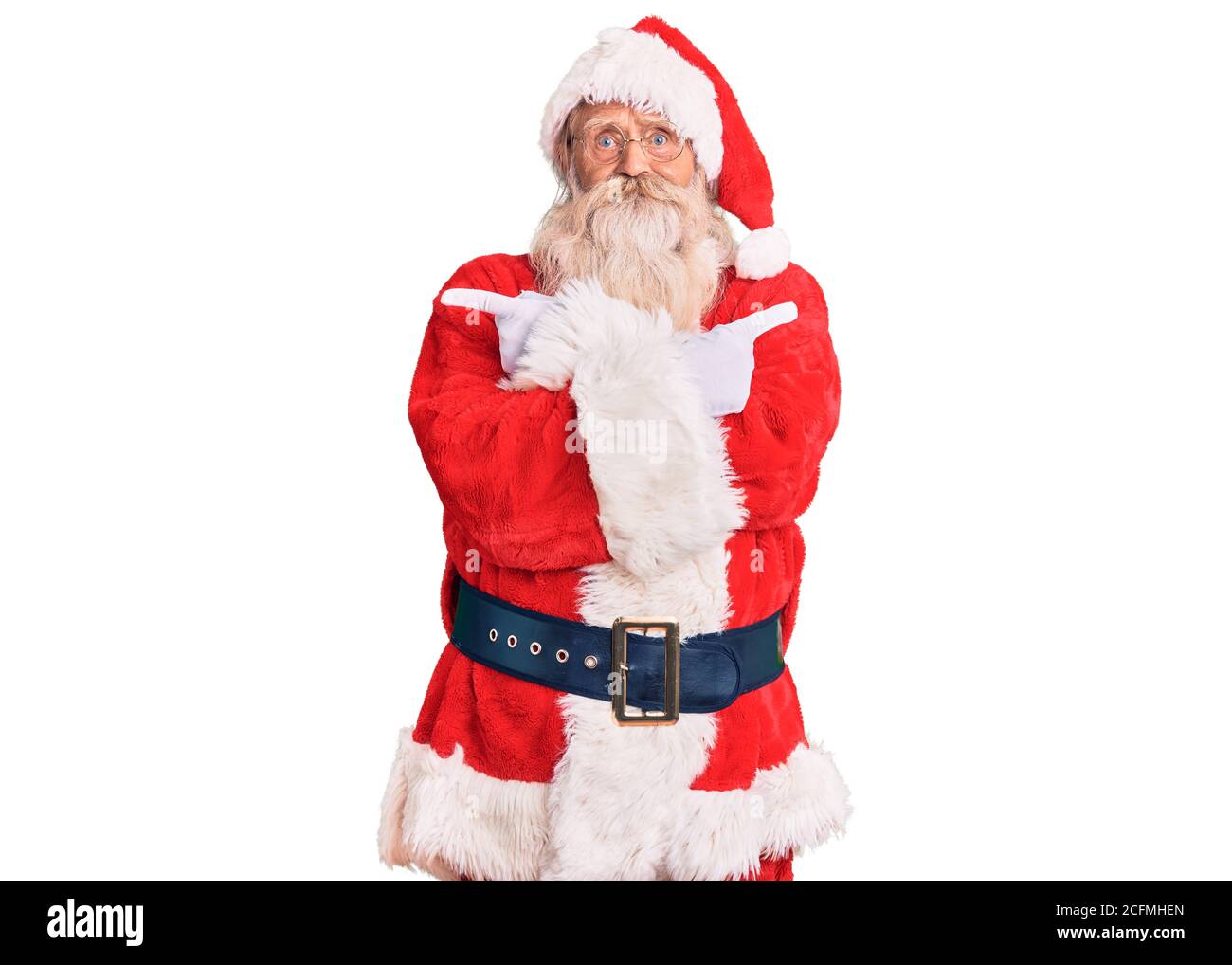 Old senior man with grey hair and long beard wearing traditional santa ...