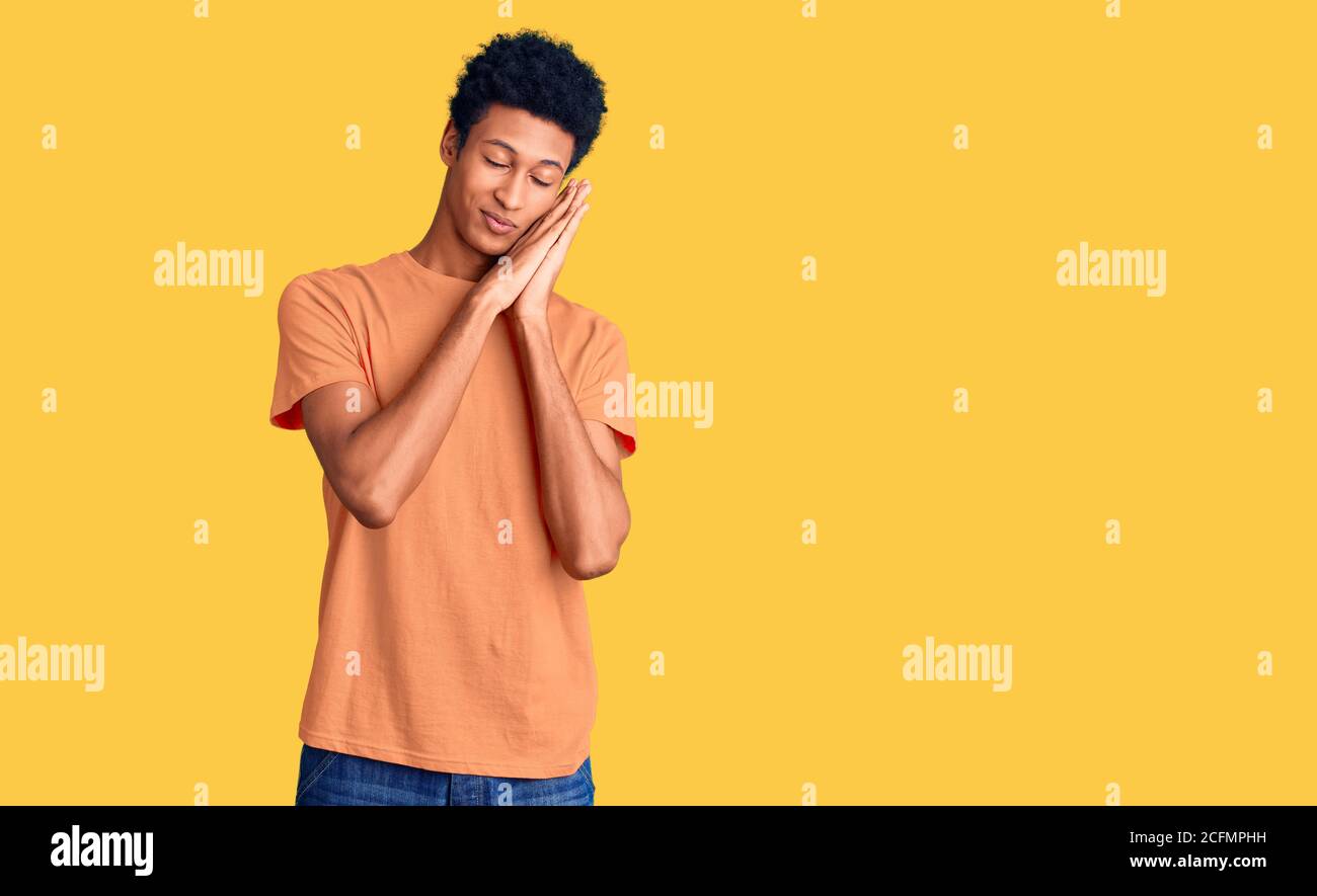 Young african american man wearing casual clothes sleeping tired ...
