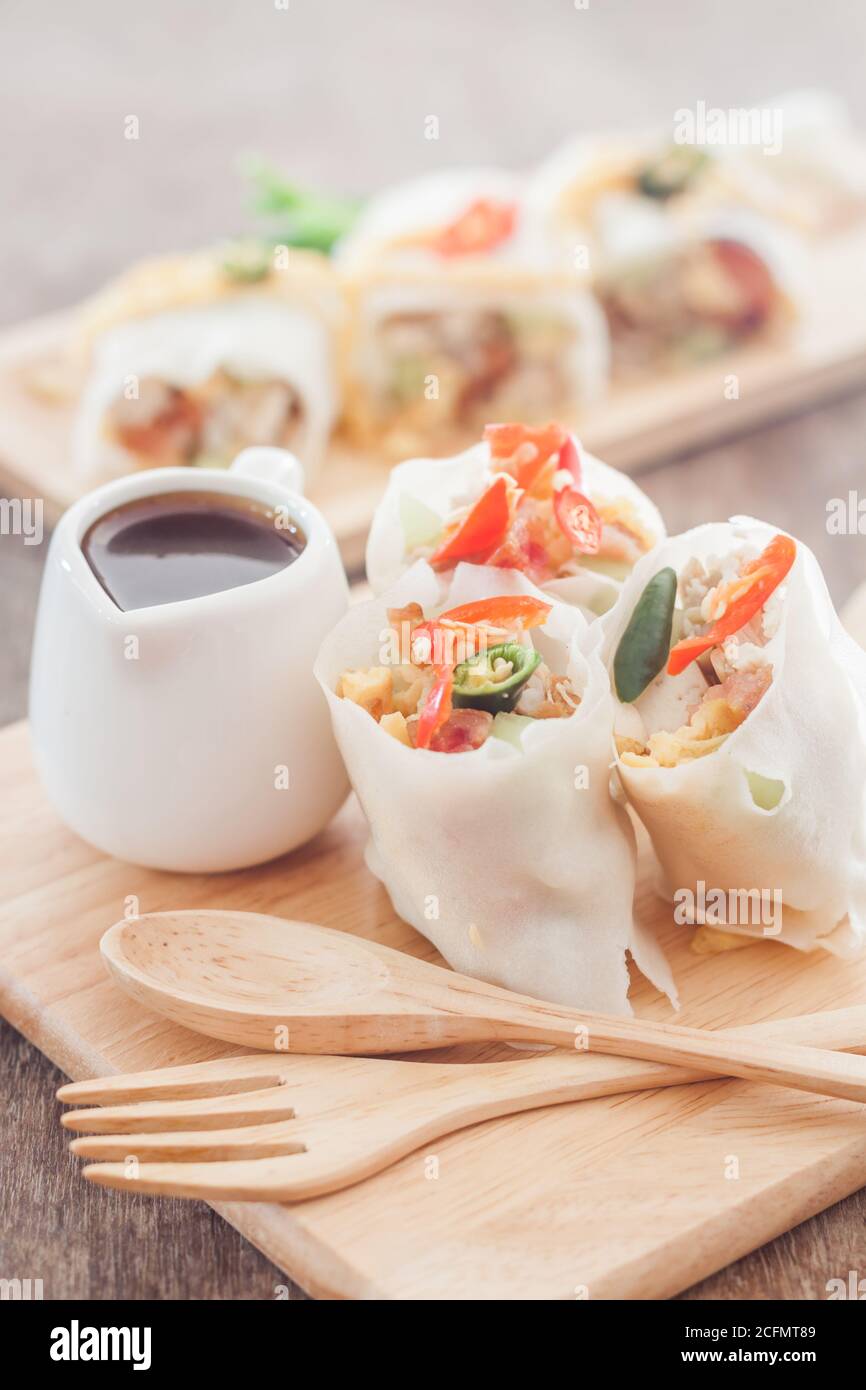Fresh spring rolls on wooden table, stock photo Stock Photo
