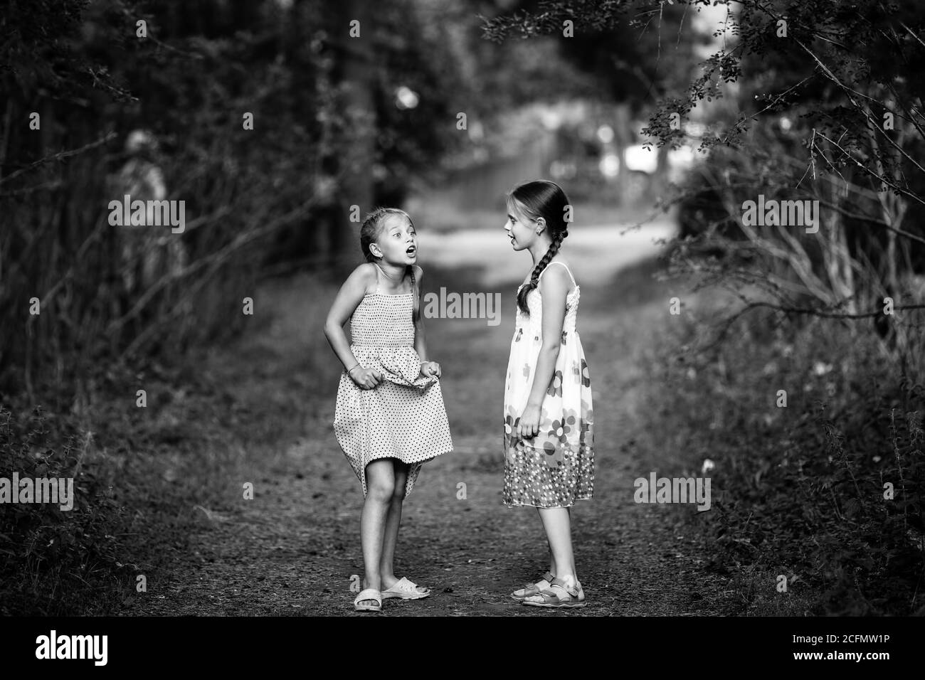 Two cute little girls playing Black and White Stock Photos & Images Alamy