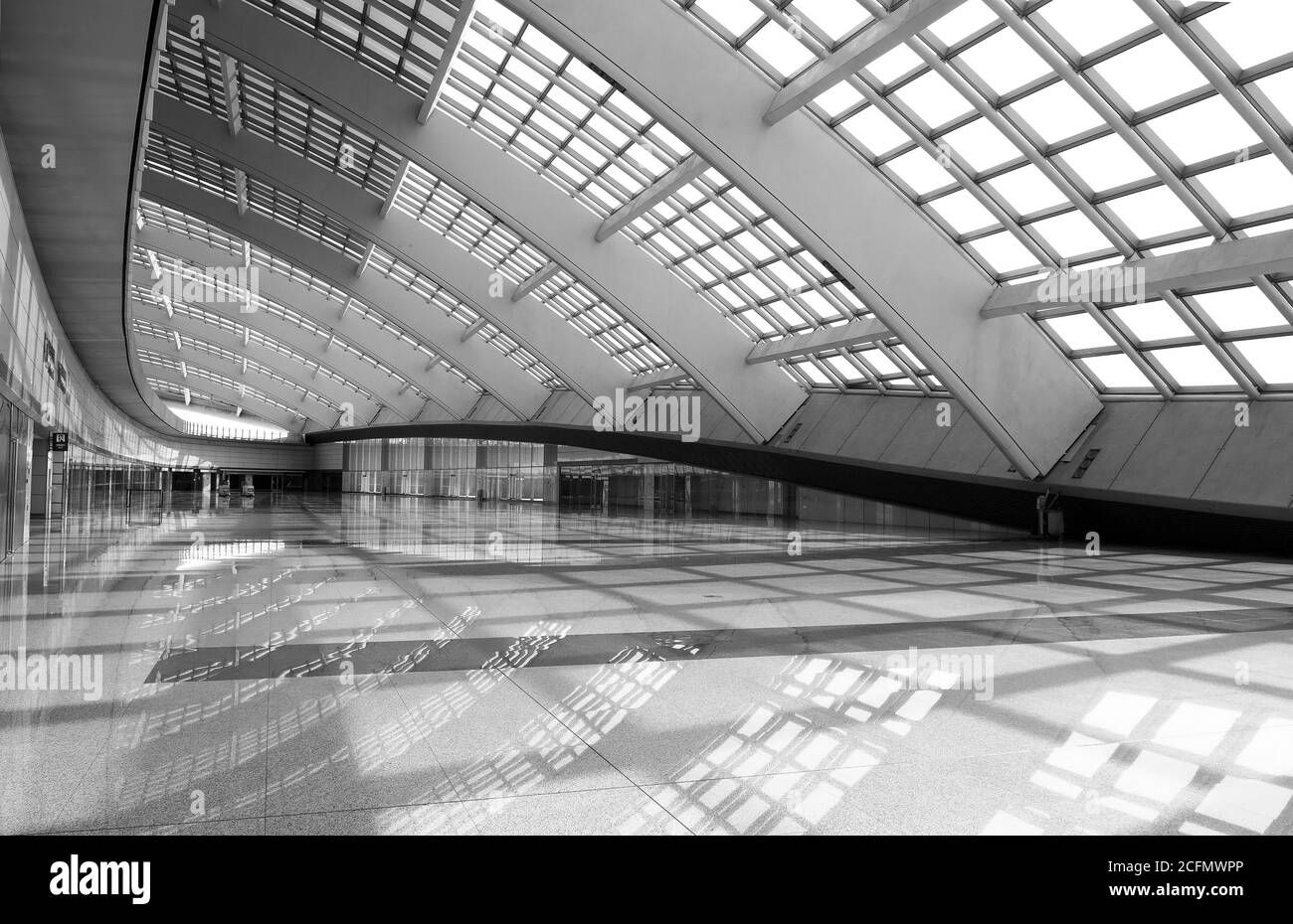 Area inside Beijing Airport with a black and white reflection of the modern architecture, China. Stock Photo