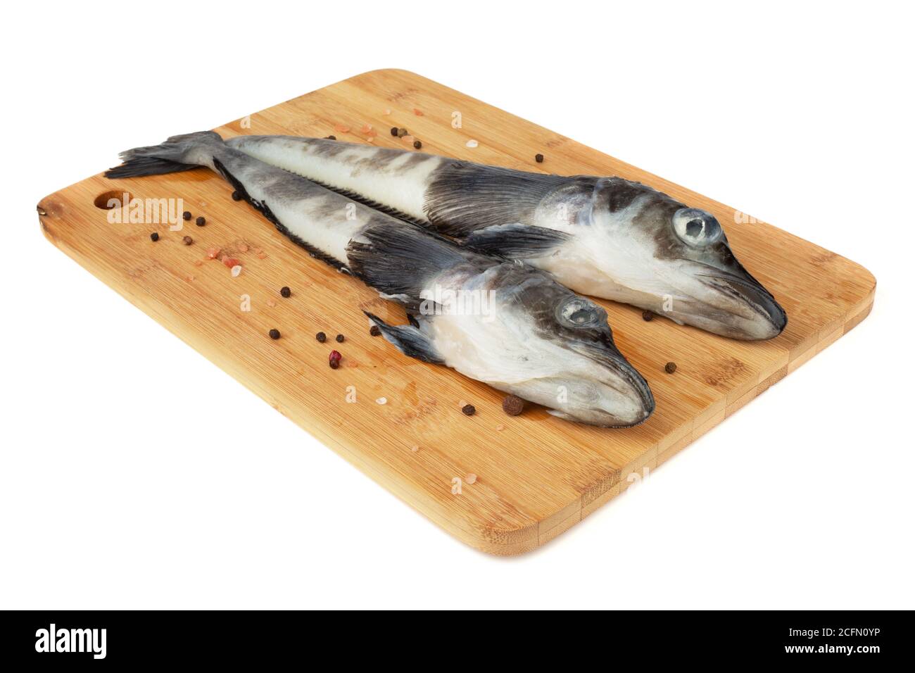 Fresh raw Mackerel Icefish ice fish on wooden cutting board isolated on white background Stock Photo