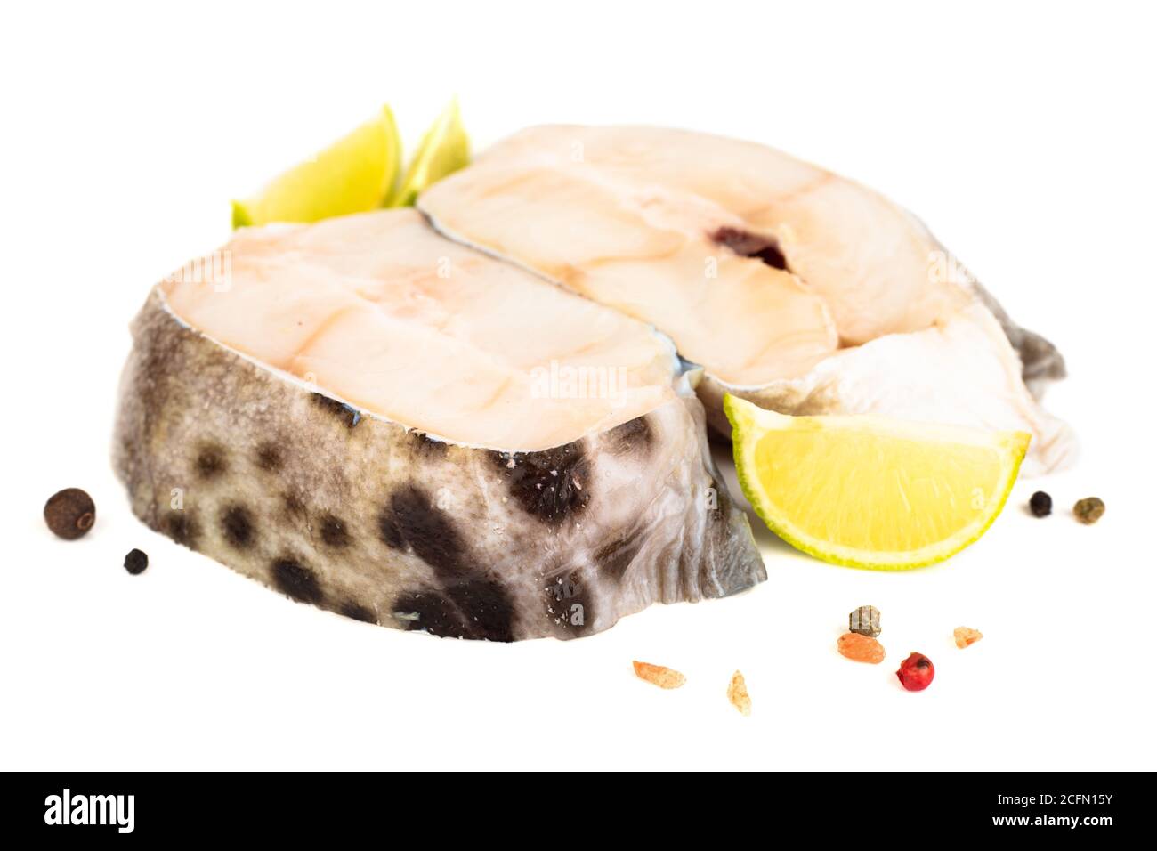 Raw catfish steak meat lime salt amd pepper studio isolated on white ...