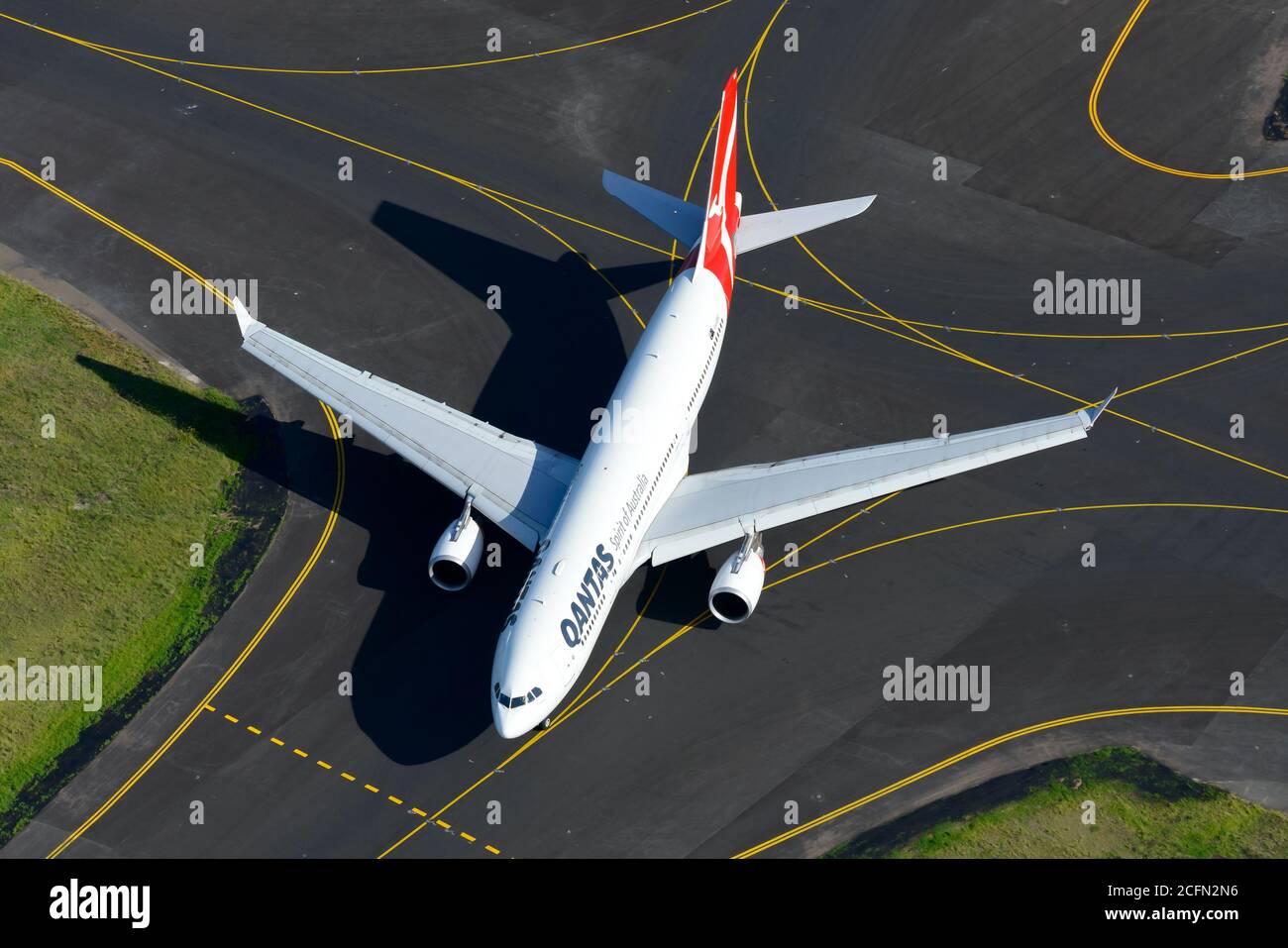 Qantas Airways Airbus A330 aerial view. Aircraft of Qantas and taxiway lines at Sydney Airport, Australia. Stock Photo