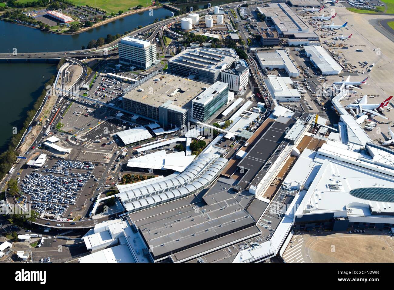 Sydney Airport aerial view with international passengers Terminal 1. Airport parking garages and access roads. Stock Photo