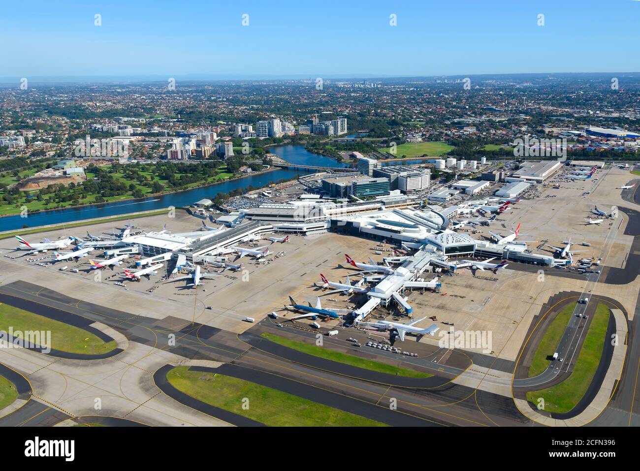 Sydney Airport aerial view with international Passengers Terminal 1 busy with international flights. Aircraft parked at Sydney Airport in Australia. Stock Photo