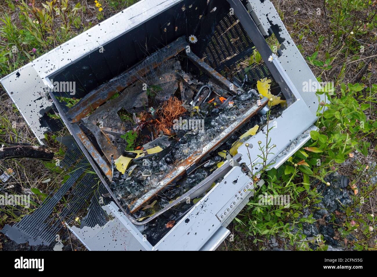 British Columbia, Canada - June 24, 2016: A destroyed and abandoned television set Stock Photo