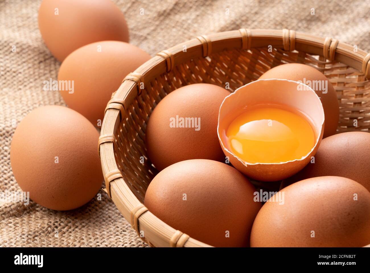 Eggs on the burlap and broken eggs are photographed from an angle Stock ...