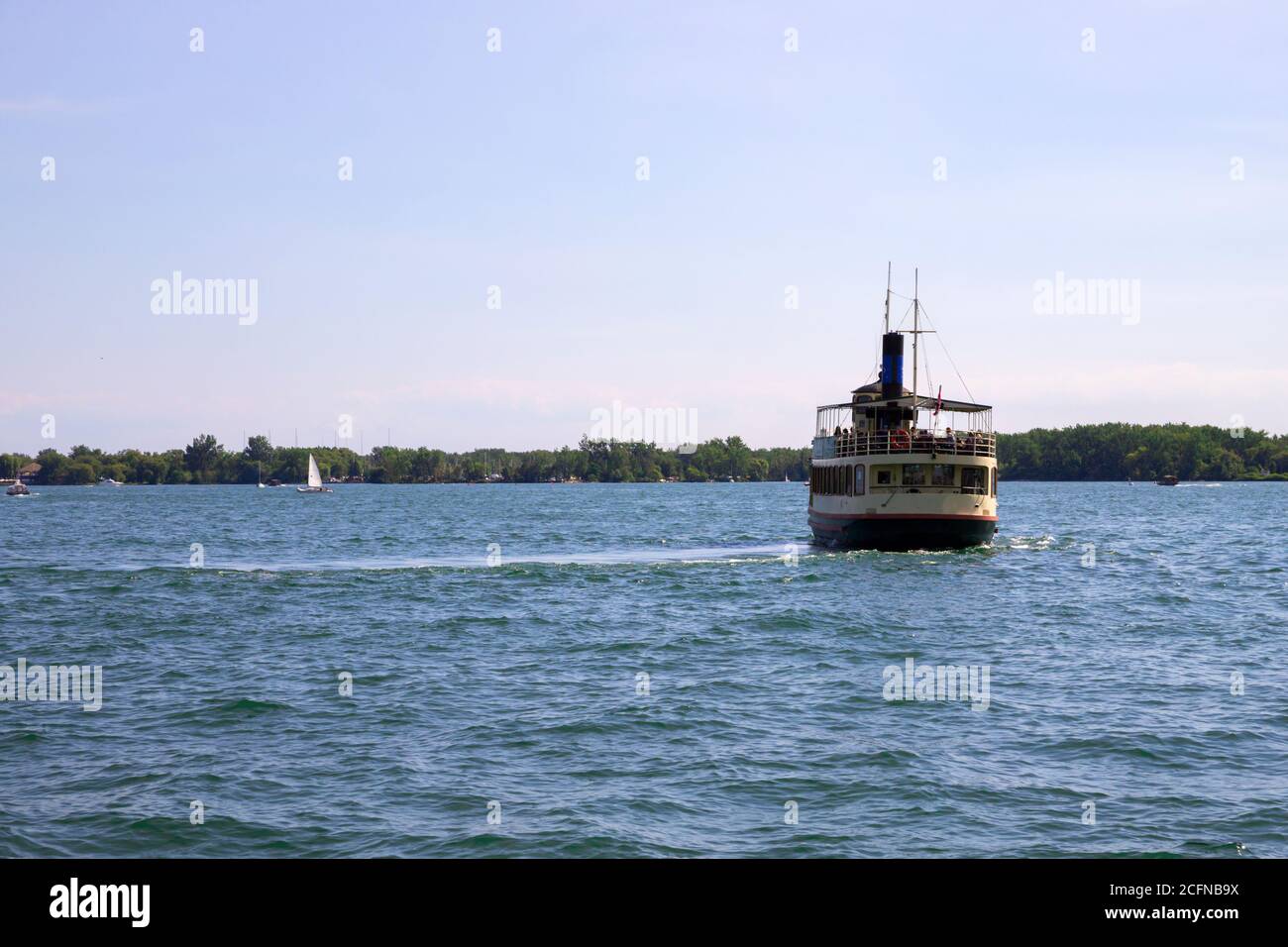 Vintage steamer ship departing from harbor Stock Photo