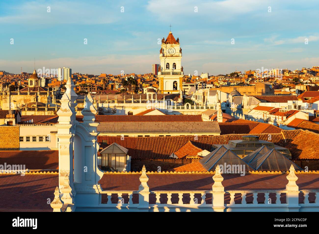 Cityscape of Sucre at sunset with its colonial style rooftops and Cathedral tower, Bolivia. Stock Photo