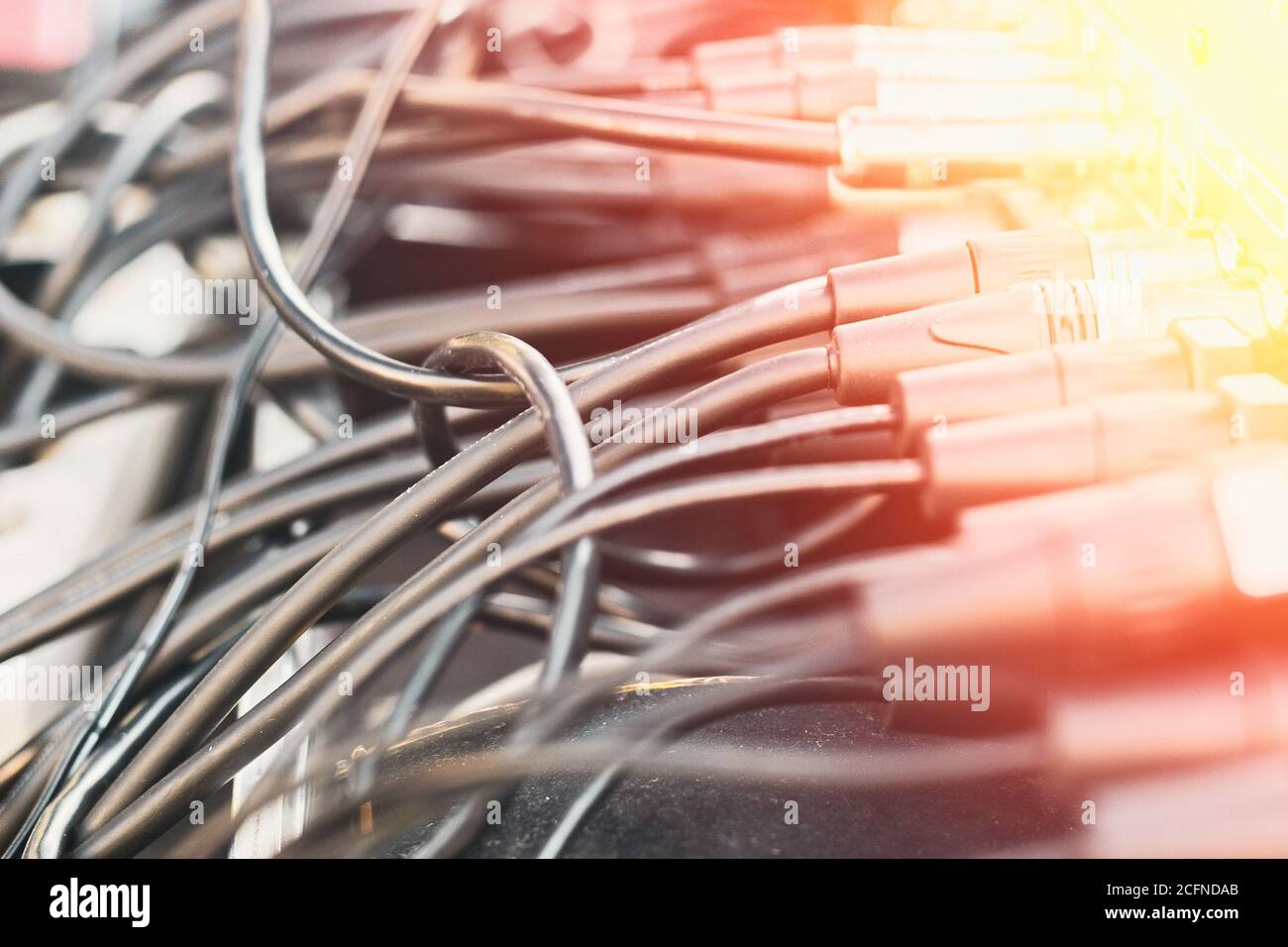 Close up audio jacks cable plugged into mixer console. XLR audio cable Stock Photo