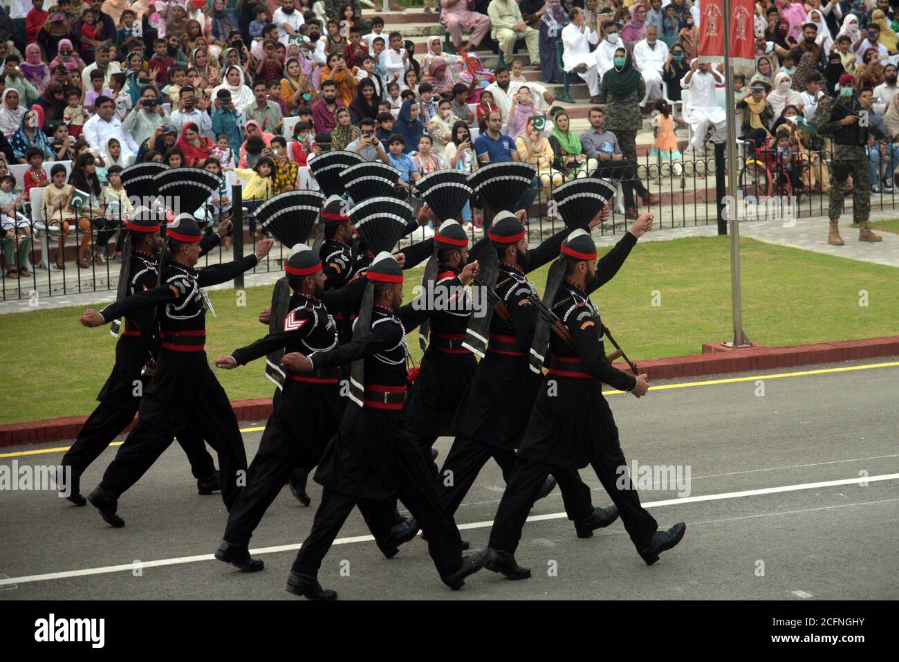 Punjab Rangers and soldiers in black uniform take a part of flag-lowering ceremony on the eve of Defense and Martyrs Day at the Joint Check Post (JCP) Wagah border in Lahore. Since the Partition of British India in 1947, Pakistan and India remained in contention over several issues. Although the Kashmir conflict was the predominant issue dividing the nations, other border disputes also existed, most notably over the Rann of Kutch, a barren region in the Indian state of Gujarat. The issue first arose in 1956 which ended with India regaining control over the disputed area. (Photo by Rana Sajid Stock Photo