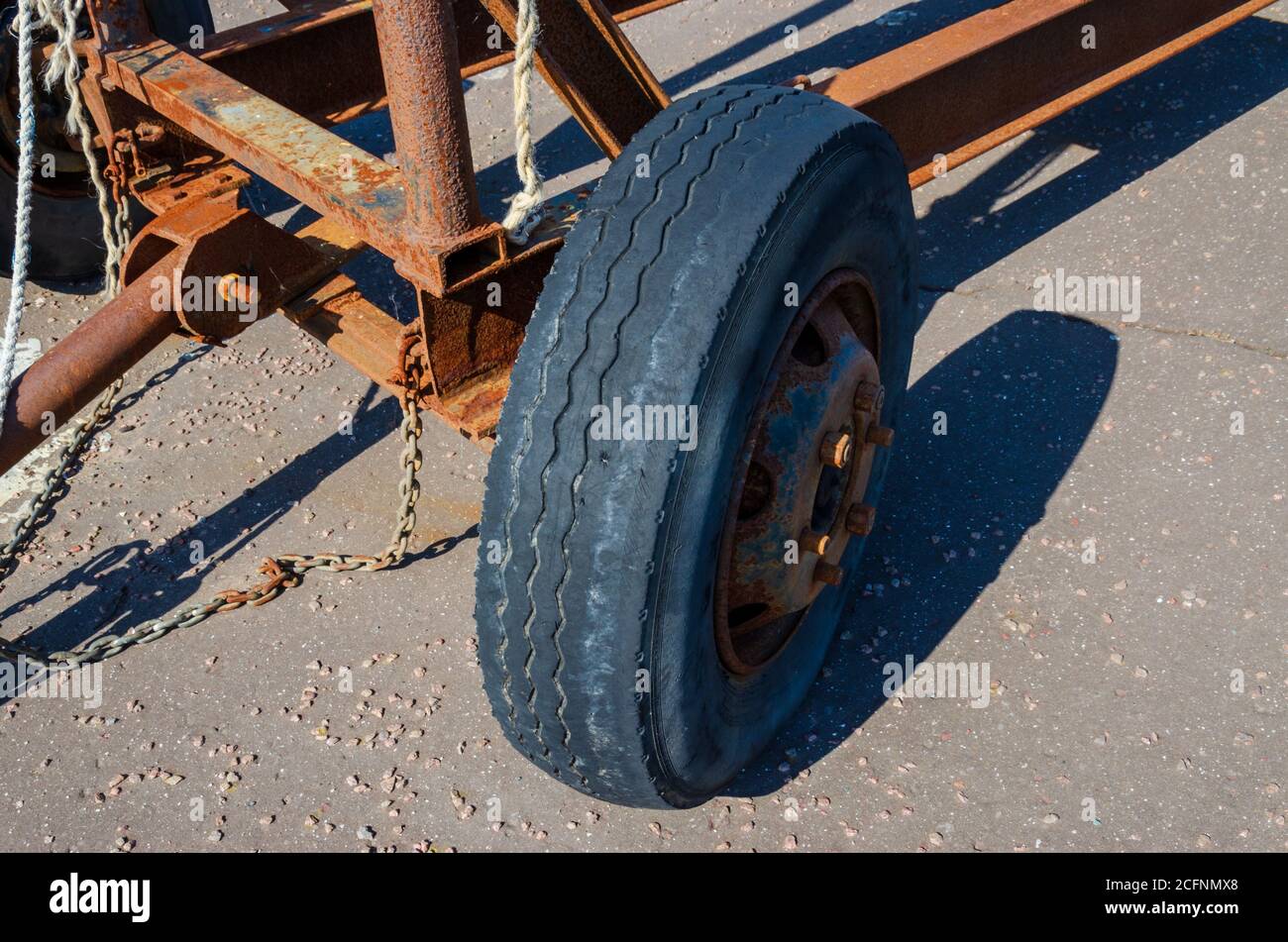 Very old rubber tyre which has worn and deteriorated badly and is illegal for road use in the UK. Stock Photo