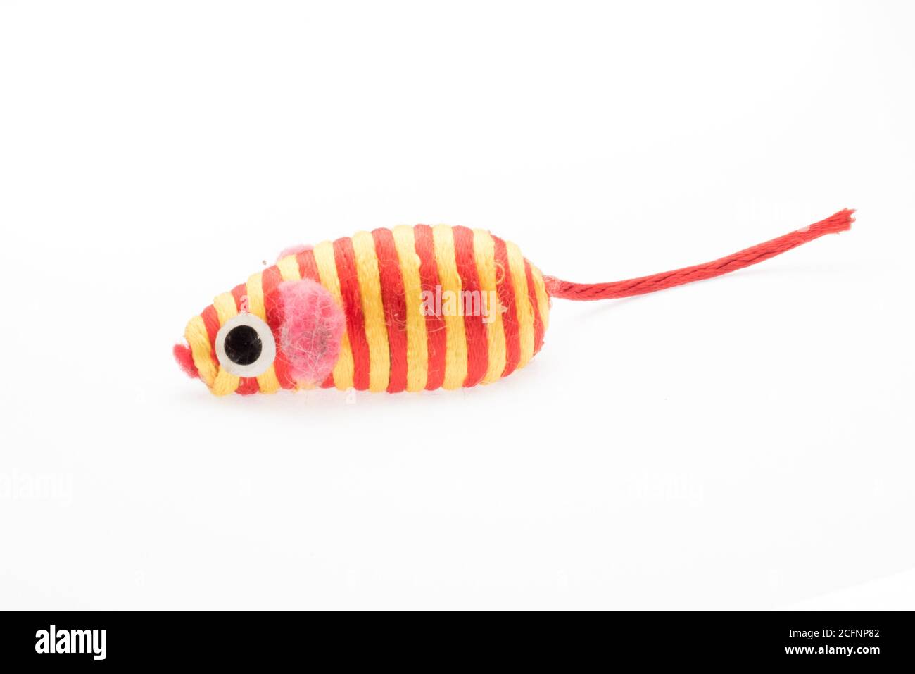 A cat toy that looks like a stripey mouse, photographed isolated on a white background. Stock Photo